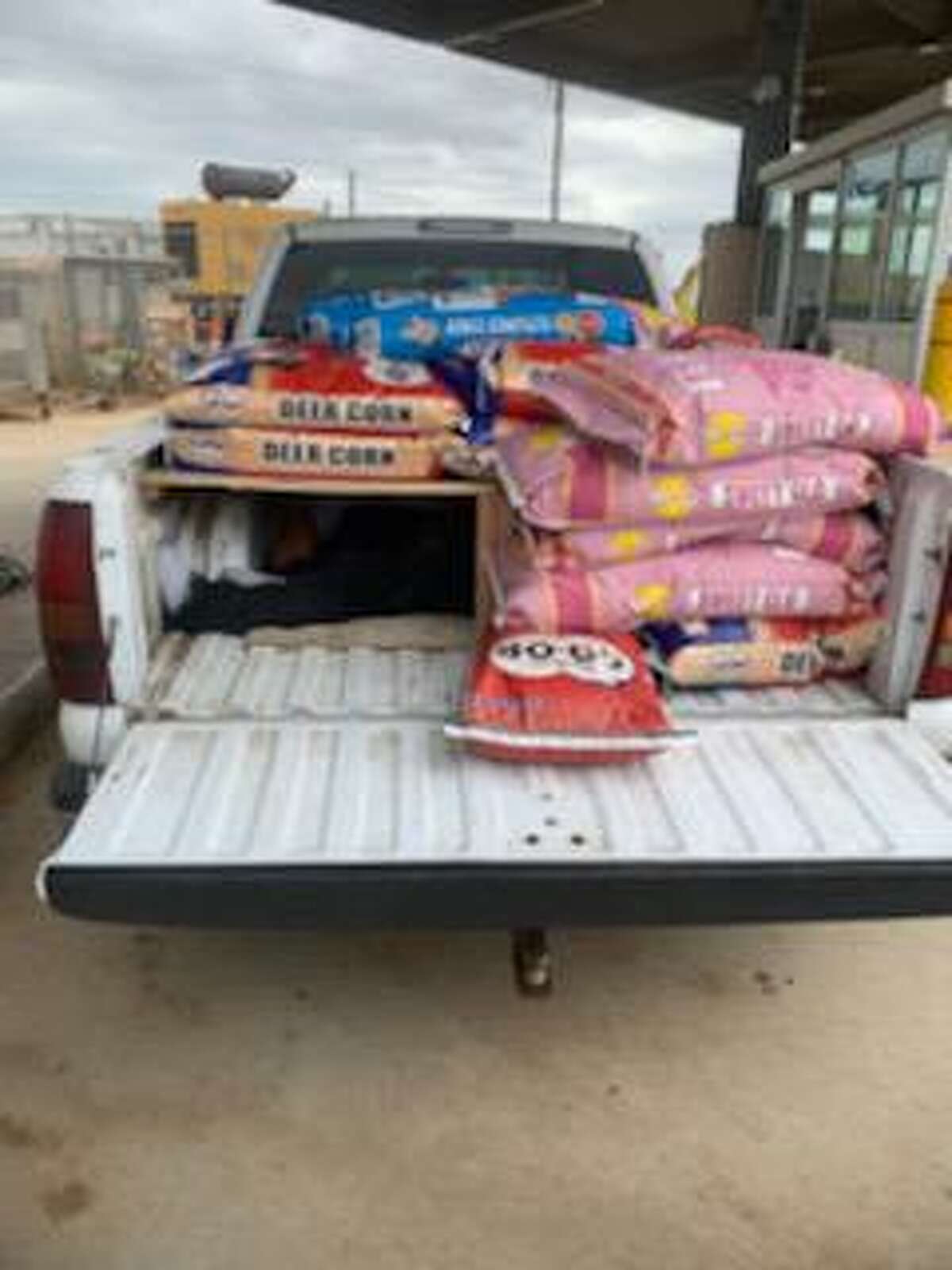 U.S. Border patrol agents found four people inside a compartment hidden underneath bags of deer corn, horse feed and dog food. The individuals were determined to be immigrants who had crossed the border illegally.