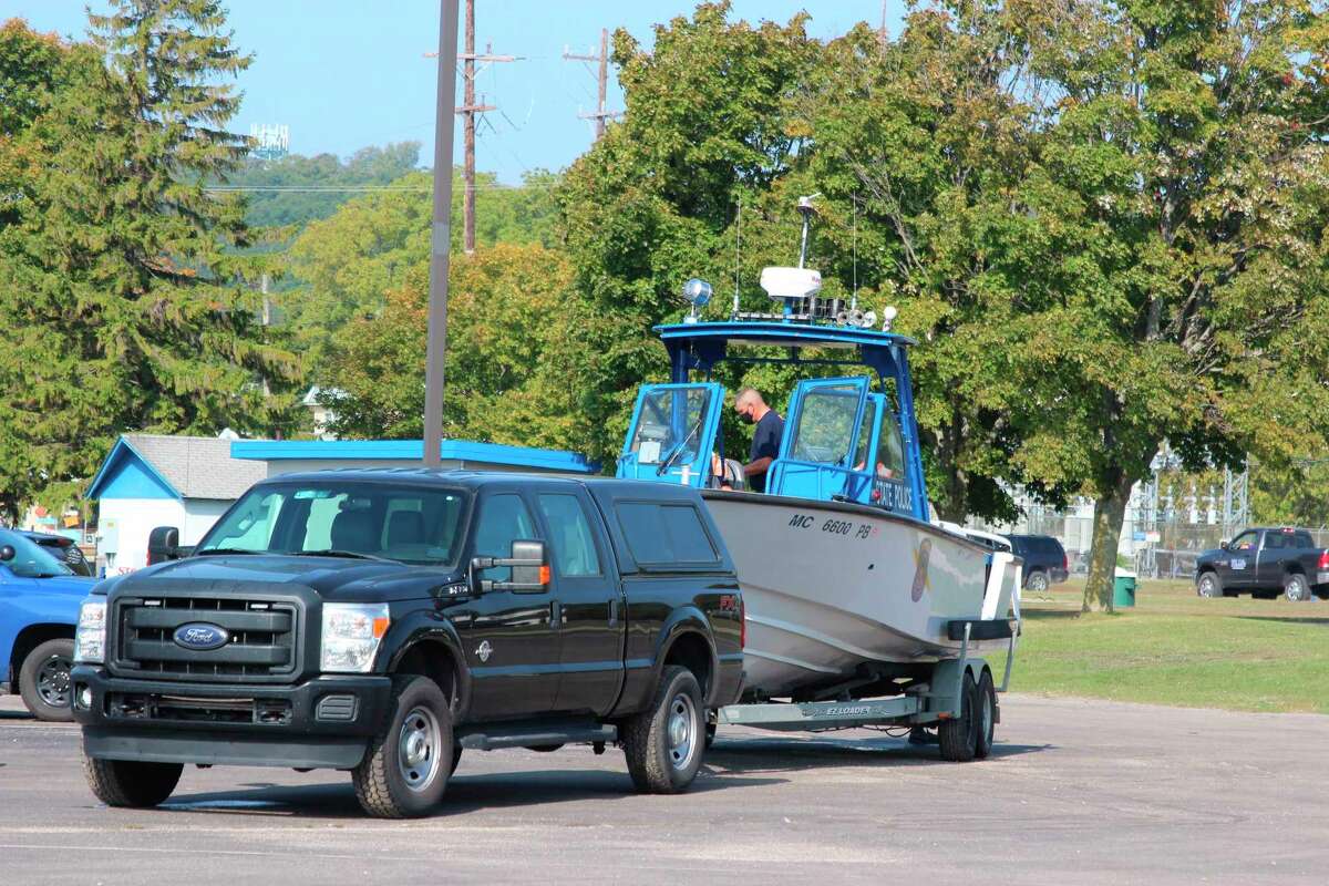 The Michigan State Police load up equipment after taking part in the successful recovery of a boy who was washed off the pier on Sept. 21. (Photo/Colin Merry)