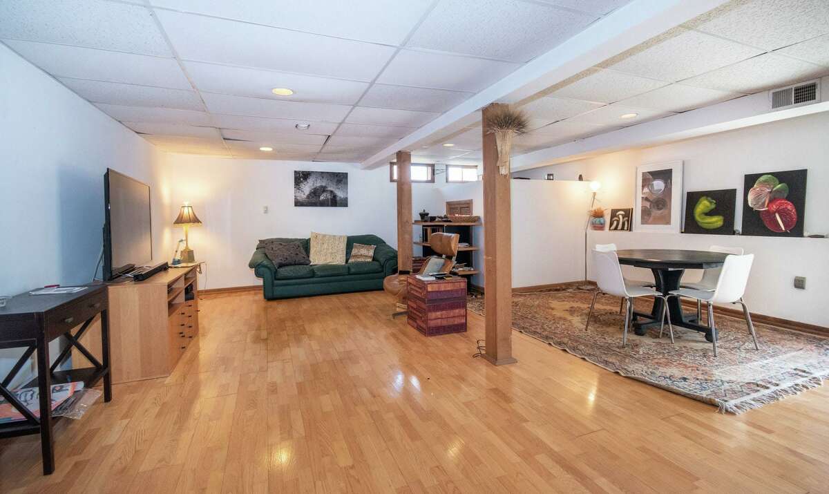 The lower level has a bedroom, kitchenette, family room, full bath and exercise room. Photographer and artist Fruma Markowitz, one of the owners, who composes beautiful paragraphs as well as beautiful images, is inspired by her own yard and the local preserved spaces. "During solitary walks, and from my garden in Weston, CT, I've gathered blossoms of trees, flowers and even weeds, as they open to the world ... I am intentionally and gratefully creating work that calls attention to nature's bountiful, optimistic reassurance - that despite these scary times, life will continue," she said, referring to the worldwide Covid-19 pandemic.