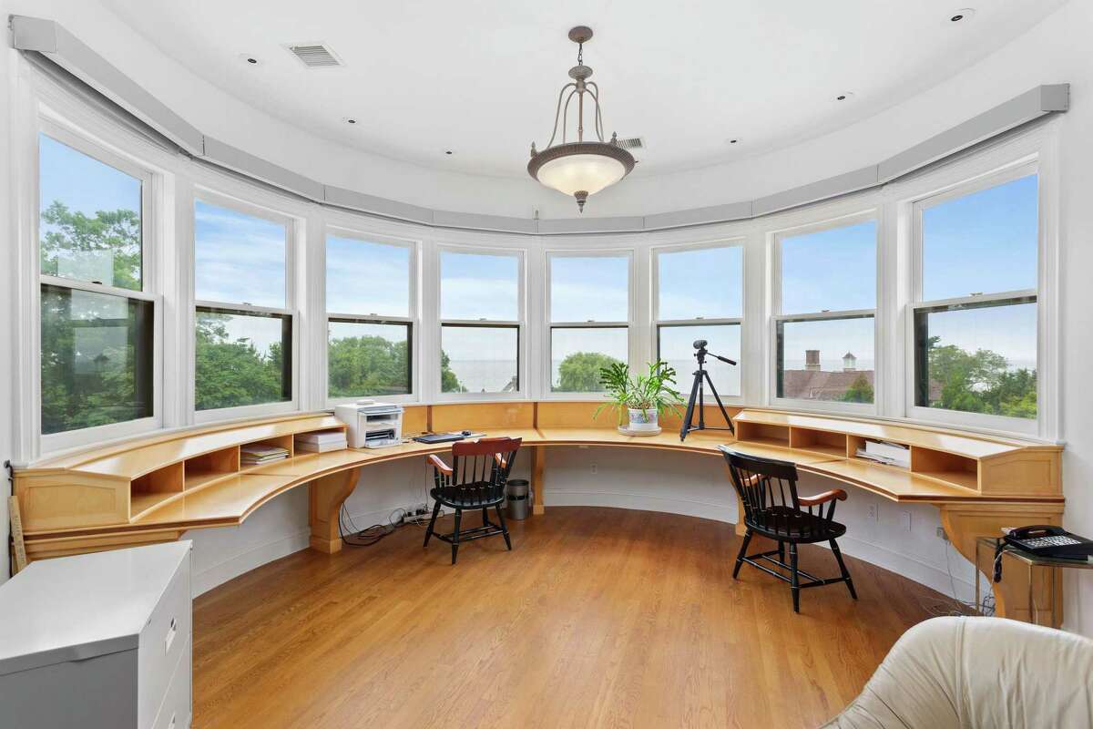 In one turret there is an office with a rounded wall of windows and a built-in rounded desk that can accommodate at least two people. This elegant Painted Lady was inspired by the Inn at Shelburne Farms when it was built in 1999 by Mickey Herbert - a former health care industry executive and former owner of the Bridgeport Bluefish professional baseball team, and his wife, Jackie. Lovers of Victorian architecture, this was the Herbert's dream house.