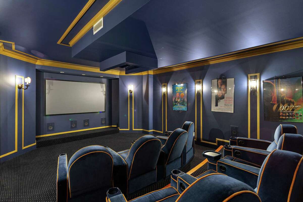 The home theater has plush seating.