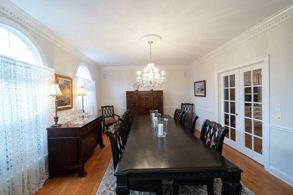 In the formal dining room there is dentil crown molding, chair railing, and French doors separating it from kitchen. In the peaceful and private backyard there is a stone patio with a stone sitting wall; the perfect place for dining al fresco, relaxing and birdwatching. This house is set well back from the road down a long gravel circular driveway that features ample parking for family and friends. This property and the house, which features 4,232 square feet and 11 rooms, is ideal for today's living and entertaining styles.