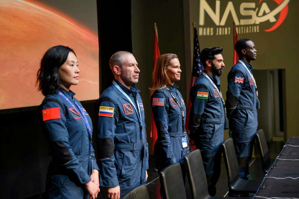 This image released by Netflix shows, from left, Vivian Wu, Mark Ivanir, Hilary Swank, Ray Panthaki and Ato Essandoh from the new series