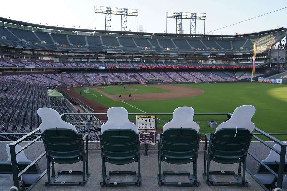 Cardboard cutouts of fans in right field look out at groundskeepers preparing the infield of Oracle Park before the start of a baseball game between the San Francisco Giants and the Arizona Diamondbacks Friday, Sept. 4, 2020, in San Francisco. (AP Photo/Eric Risberg) Photo: Eric Risberg / Associated Press