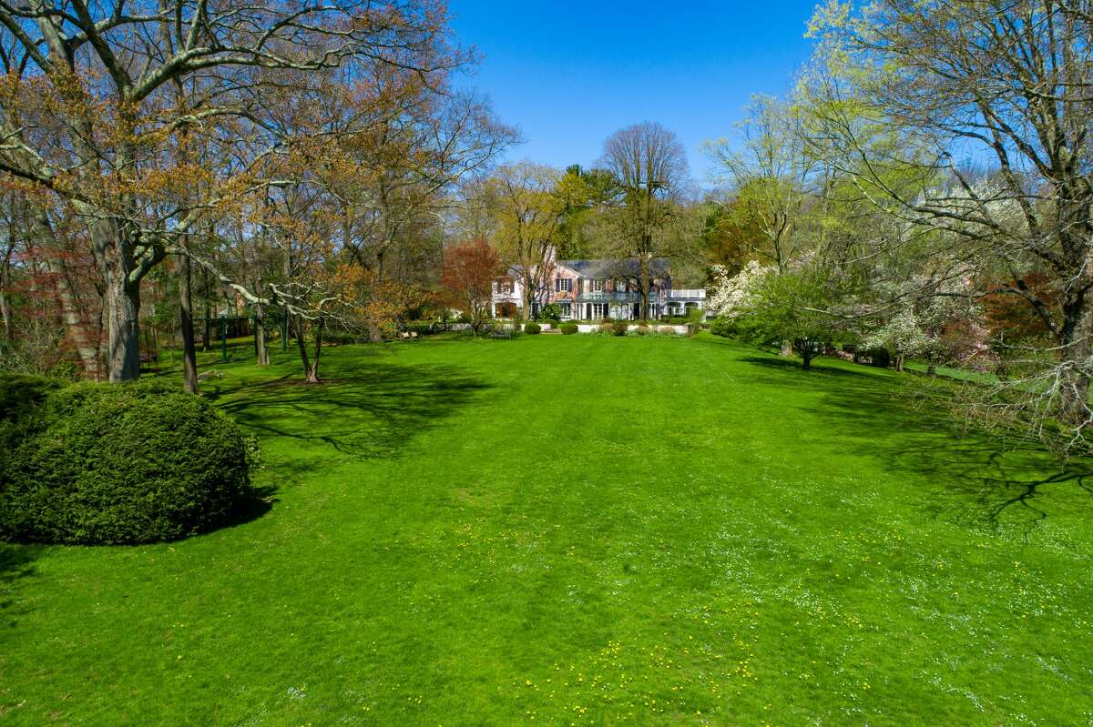 Musician Paul Simon's New Canaan, Conn. estate is on the market for $11.9 million. The grounds provide a parklike idyll with sweeping meadows, formal walled gardens and a swimming pool scenically sited on a grassy plateau with serene views over a placid private pond. Just inside the main gates and a good distance from the main house, a 2,400-square-foot cottage, which the couple used as a recording studio, makes a perfect caretaker’s home or guesthouse.
