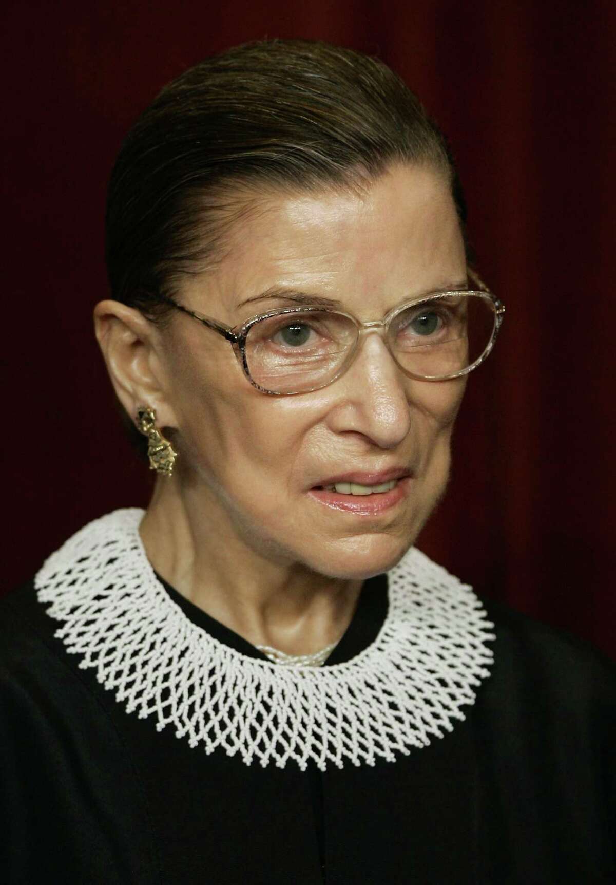 ** FILE ** In this March 3, 2006 file photo, Associate Justice Ruth Bader Ginsburg joins the members of the Supreme Court for photos during a group portrait session at the Supreme Court Building in Washington. Ginsburg died last week. (AP Photo/J. Scott Applewhite, File)