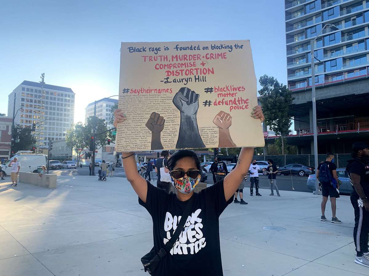 Srishti Prabha, 29, of San Jose, attends a demonstration in Downtown San Jose on Wednesday, Sept. 23, 2020. Dozens of masked protesters gathered in front of the San Jose City Hall rotunda.