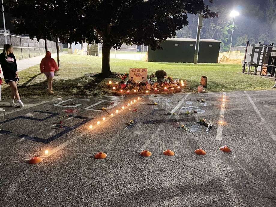 A memorial was set up in the junior lot at Wilton High School to honor the memory of George DiRocco, who passed on Sept. 21, 2020. Photo: Jake Sommer Photo
