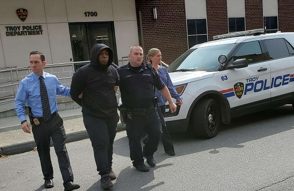 Troy police detective and patrol officer lead Jahquay E. Brown from the detective bureau to arraignment in Troy City Court Thursday, Sept. 24, 2020.Troy police detective and patrol officer lead Jahquay E. Brown from the detective bureau to arraignment in Troy City Court Thursday, Sept. 24, 2020.