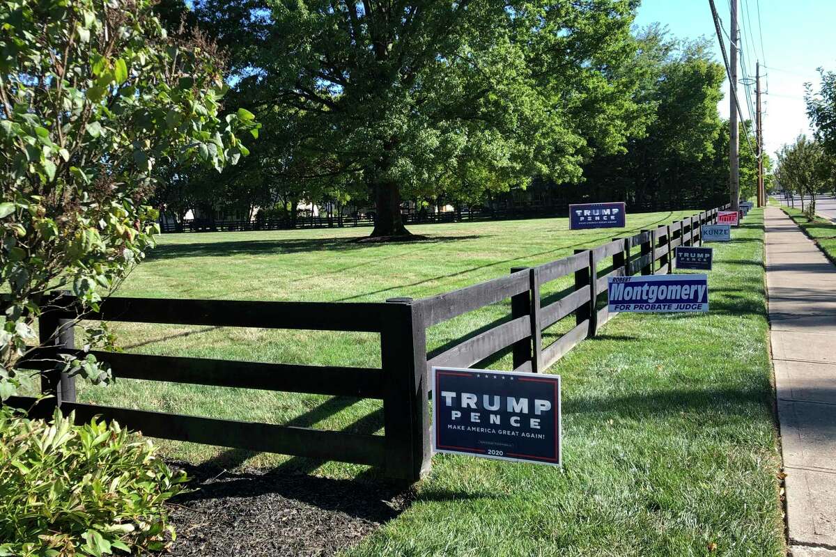 Signs in support of President Donald Trump and other Republican candidates on a lawn of a suburban Dublin, Ohio, home on Sept. 18.