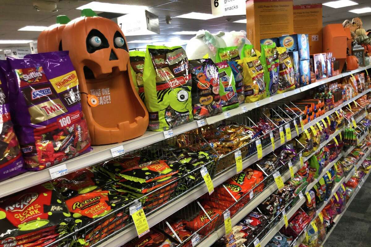 Halloween candy and decorations are displayed at a store, Sept. 23, 2020, in Freeport, Maine. U.S. sales of In this year of the pandemic, with trick-or-treating still an uncertainty, Halloween candy were up 13% over last year in the month ending Sept. 6, according to data from market research firm IRI and the National Confectioners Association. (AP Photo/Robert F. Bukaty)
