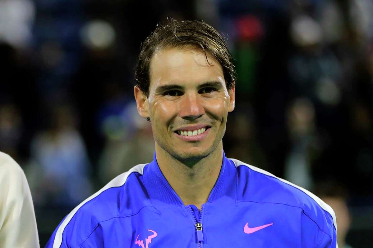 FILE - In this Saturday, Dec. 21, 2019, file photo, Rafael Nadal from Spain smiles after defeating Stefanos Tsitsipas of Greece at the Mubadala World Tennis Championship in Abu Dhabi, United Arab Emirates. Nadal is ranked No. 2 heading into the French Open. (AP Photo/Kamran Jebreili, File)