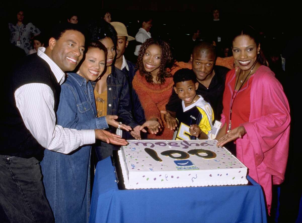 Actress Brandy (Center, Orange Sweater), Star Of Upn's "Moesha" And Her Castmates William Allen Young, Yvette Wilson, Shar Jackson, Ray J, Marcus T. Paulk, Lamont Bentley, And Sheryl Lee Ralph Celebrate The 100Th Episode Of The Comedy Series. (Photo By Getty Images)