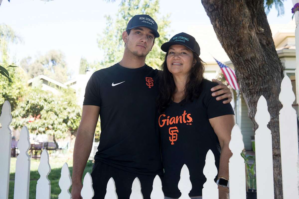 San Francisco Giants minor league pitcher Kanoa Pagán poses for a photo with his mother Lisa at their house in Campbell, Calif., on September 22, 2020. Pagán had his second minor league season canceled because of the COVID-19 pandemic. His family has also dealt with the tragic death of his 8-year-old brother Koa, who suddenly passed due to leukemia in April.
