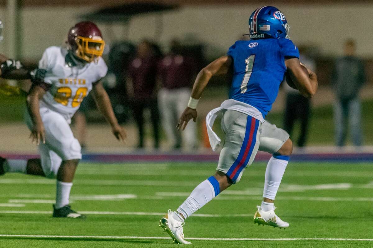 Bruins quarterback Bryce Anderson (1) scrambles with the ball in the first half as the Beaumont United Timberwolves and the West Brook Bruins squared off in the Alumni Bowl Scrimmage at BISD Memorial Stadium on Thursday night. Photo made on September 24, 2020. Fran Ruchalski/The Enterprise