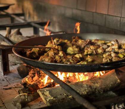 Carbon steel paella pans are safe and easy to use over open fires.