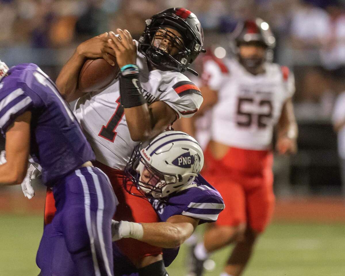Titans quarterback Jah'mar Sanders (1) is wrapped up on a quarterback keeper in the first quarter. Port Neches-Groves hosted Port Arthur Memorial in the 5A season opener for both programs. Photo made on September 25, 2020. Fran Ruchalski/The Enterprise