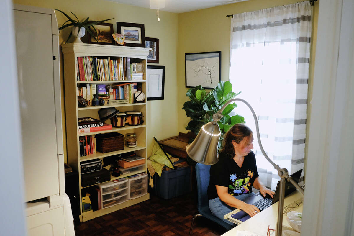 Violetta DeRosa, a teaching assistant, special education, for the Albany School District, works in her office at her home on Thursday, Sept. 24, 2020, in Albany, N.Y. This is were DeRosa would work with students and families when doing remote learning. (Paul Buckowski/Times Union)