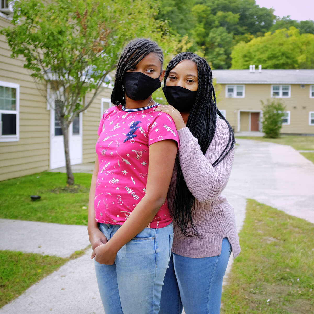Akira Marshall, right, and her daughter, Damirah Corbitt, 12, outside their home on Thursday, Sept. 24, 2020, in Albany, N.Y. Corbitt is a home school coordinator at the Montessori Magnet School for the Albany School District. (Paul Buckowski/Times Union)