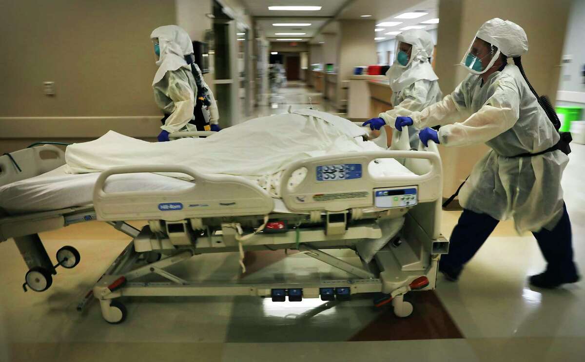 Dr. Tamara Simpson and two nurses rush a patient to the Northeast Baptist Hospital COVID-19 Unit, on April 24, 2020. The number of patients with the virus in San Antonio hospitals has been dropping steadily in recent weeks but every few days there’s a slight increase as there was Saturday, when Metro Health reported 85 patients infected with the disease, three more than Friday.