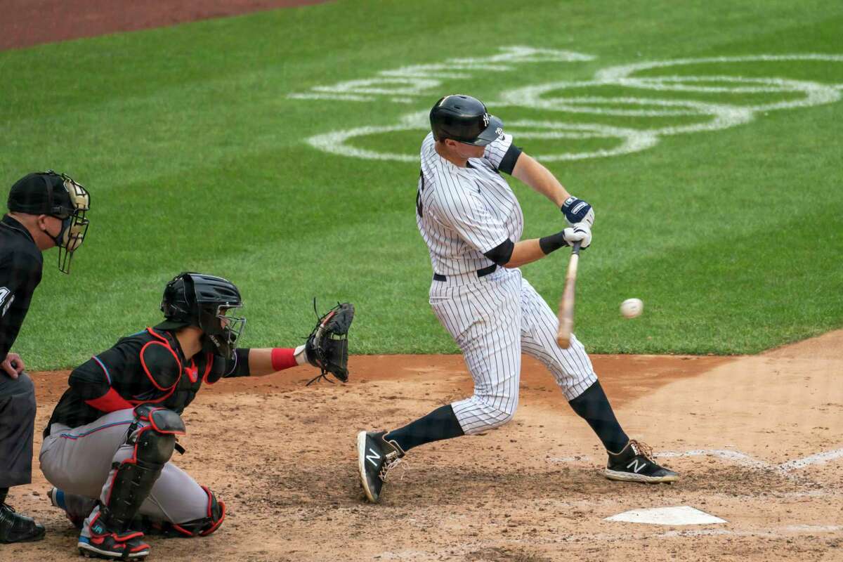 New York Yankees' DJ LeMahieu hits a two-run double during the sixth inning of a baseball game against the Miami Marlins at Yankee Stadium, Saturday, Sept. 26, 2020, in New York. (AP Photo/Corey Sipkin)