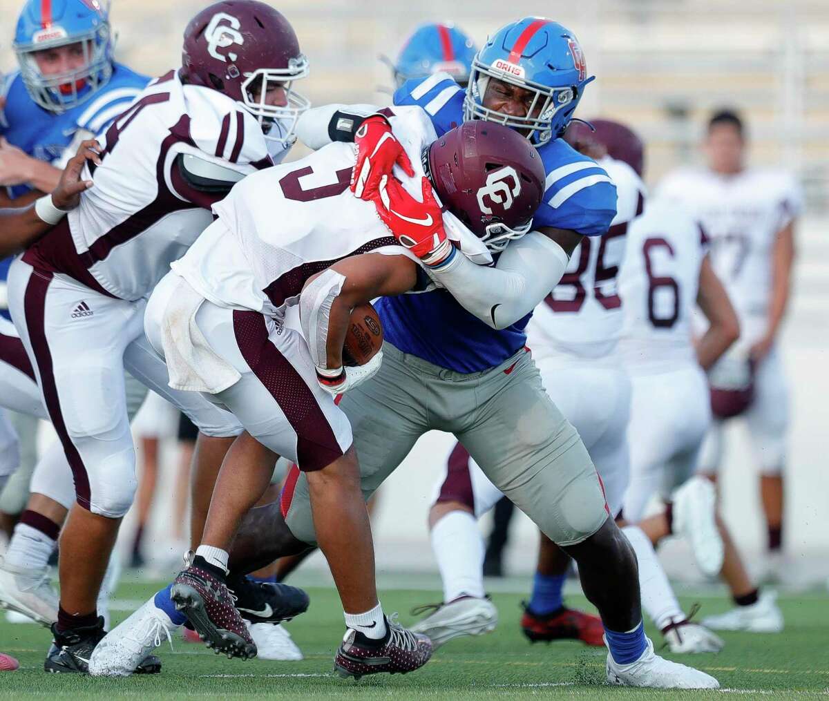 Oak Ridge outside linebacker KC Ossai (8) tackles Clear Creek running back Jeremiah Crum (5) for a loss on third down during the first quarter of a non-district high school football game at Woodforest Bank Stadium, Saturday, Sept. 26, 2020, in Shenandoah.