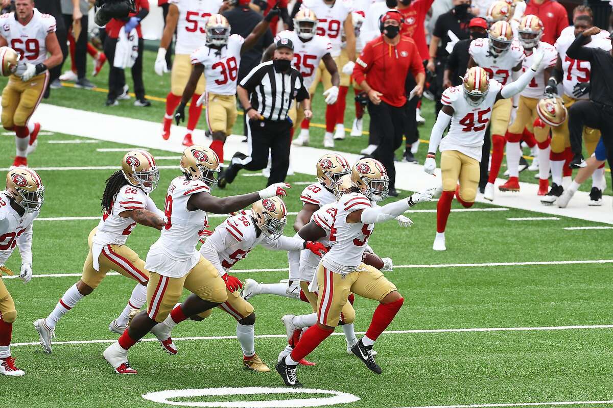 San Francisco 49ers wide receiver Brandon Aiyuk (11) celebrates scoring a  touchdown with quarterback Nick Mullens (4) against the New York Giants  during an NFL football game, Sunday, Sept. 27, 2020, in