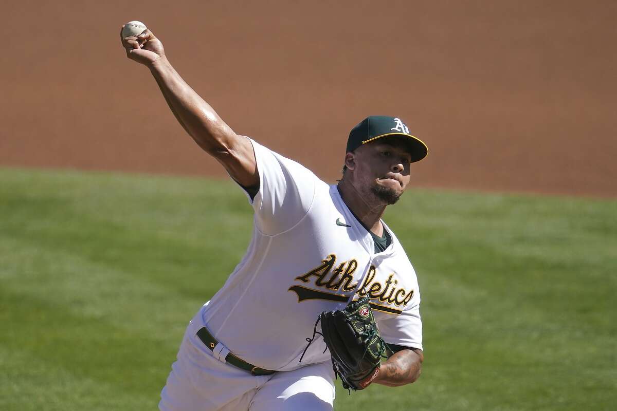Oakland Athletics' Frankie Montas pitches against the Seattle Mariners during the first inning of a baseball game in Oakland, Calif., Sunday, Sept. 27, 2020. (AP Photo/Jeff Chiu)