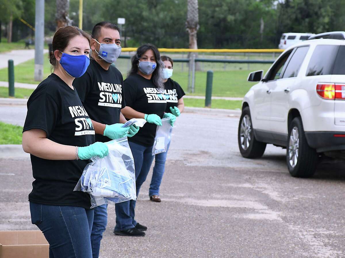 FILE — Medline, one of the largest employers in Laredo and North America’s largest privately-held medical supply manufacturer and distributor in collaboration with the City of Laredo, distributed free masks, sanitizers and Census 2020 material to Laredoans at Slaughter Park, Saturday, September 26, 2020.