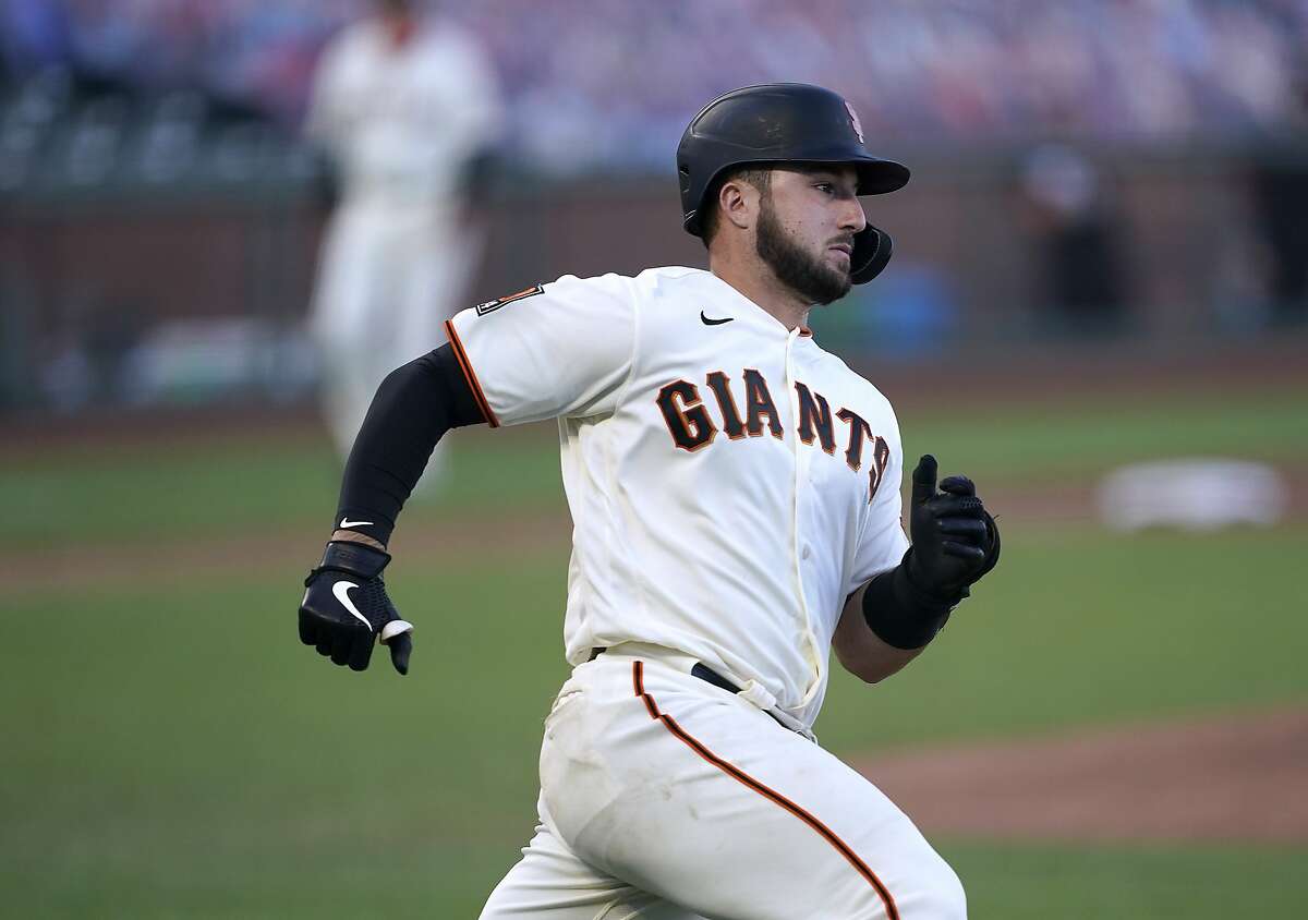 San Francisco Giants' Joey Bart runs to first base after hitting an RBI single against the San Diego Padres during the fourth inning of the first game of a baseball doubleheader Friday, Sept. 25, 2020, in San Francisco. (AP Photo/Tony Avelar)