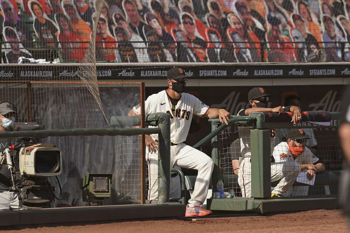 San Francisco Giants manager Gabe Kapler stands in the dugout and watches the final moments in the ninth inning of a baseball game against the San Diego Padres Sunday, Sept. 27, 2020, in San Francisco. San Diego won the game 5-4. (AP Photo/Eric Risberg)