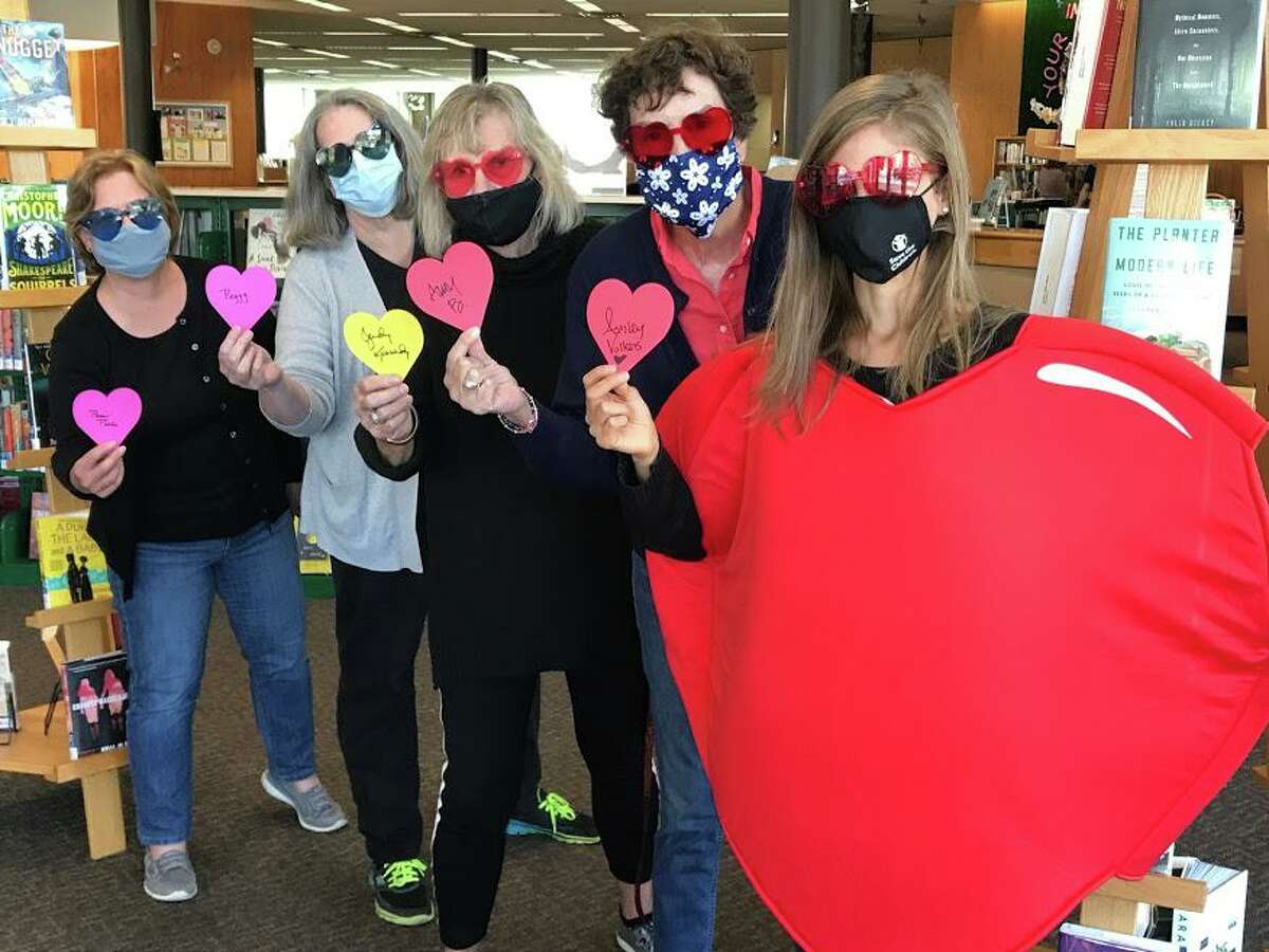 Members of the Friends of the Milford Library leadership hold up their signed hearts: Pam Pilla, Peggy Bolger, Judy Kennedy, Amy Bringardner, and Ashley Volkens.