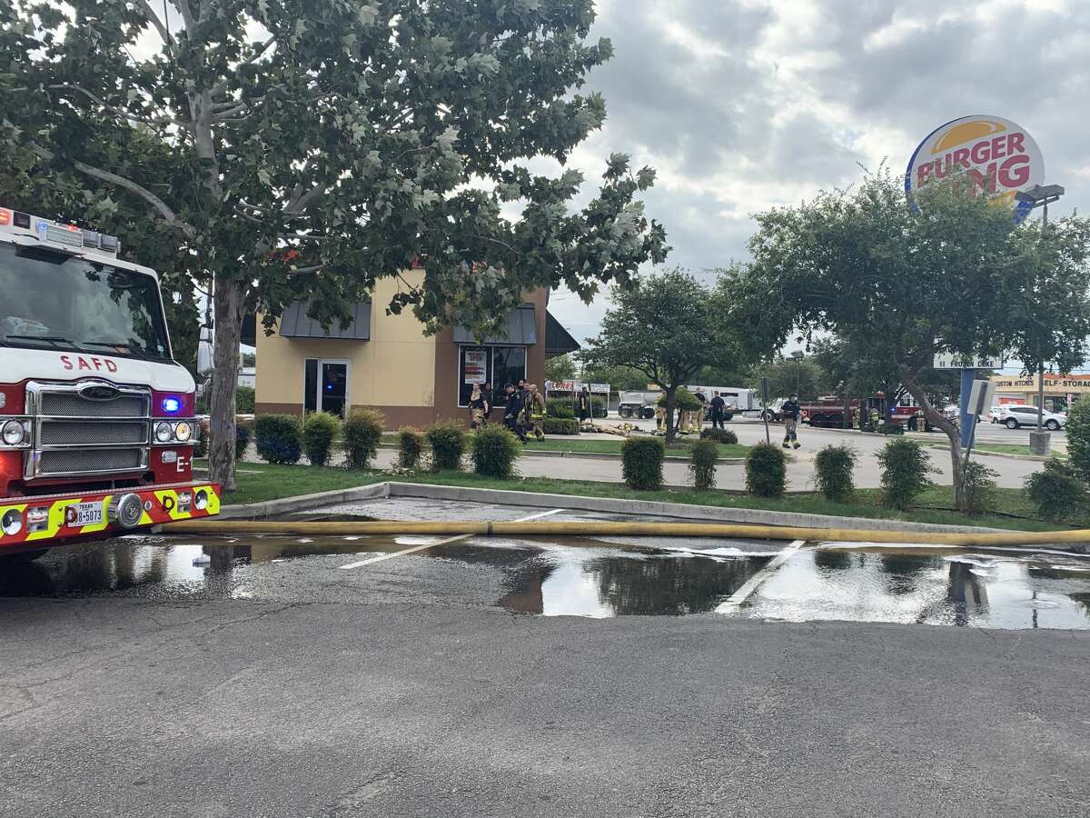San Antonio firefighters battled to save an East Side Burger King after grease caused the roof of the fast food restaurant to catch fire, according to authorities on the scene.