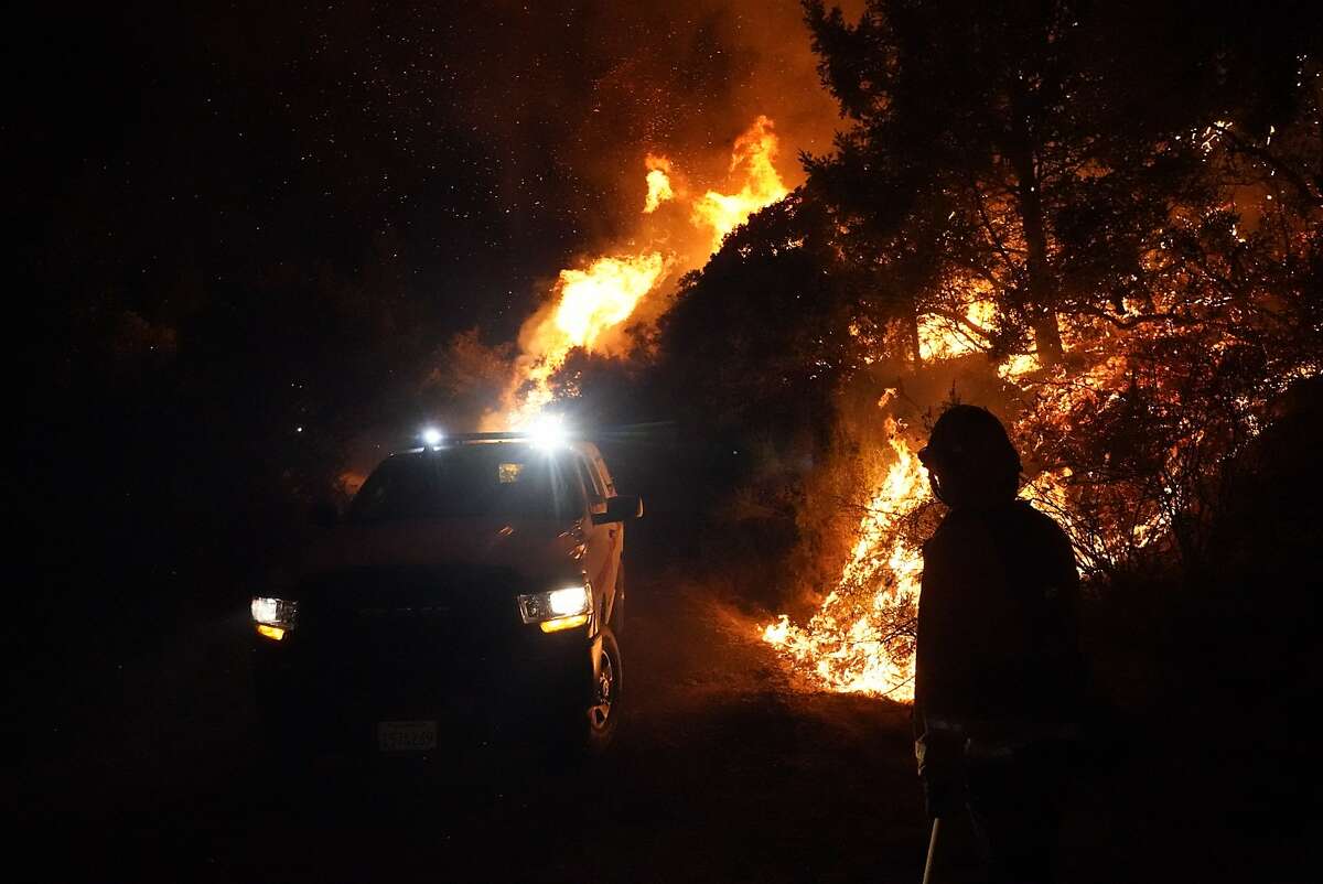Firefighter strike forces fighting the Glass Fire on Sunday in Calistoga.