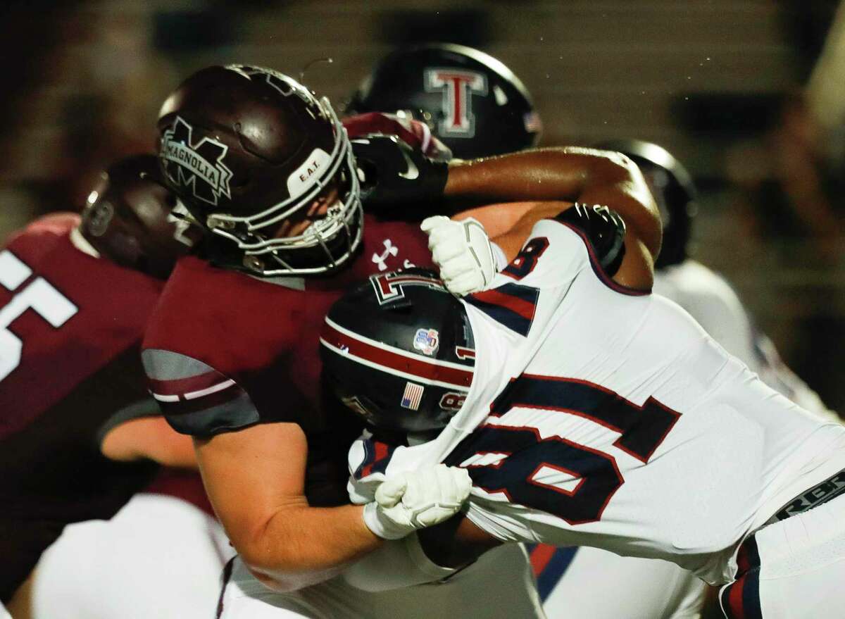 Magnolia offensive linemen Matthew Wykoff (74) goes up against Katy Tompkins defensive linemen Sean Dubose (81) during the second quarter of a non-district high school football game at Bulldog Stadium, Friday, Sept. 25, 2020, in Magnolia.
