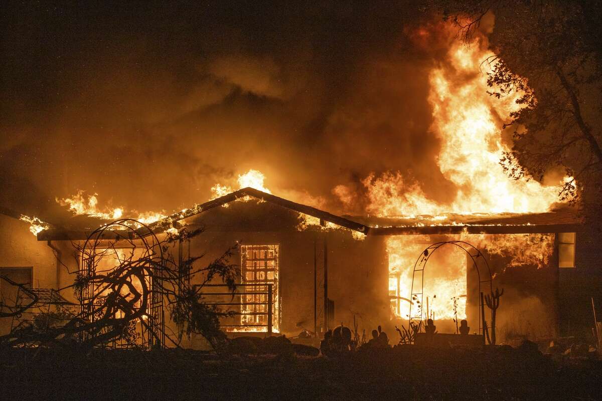 A house burns on Platina Road at the Zogg Fire near Ono, Calif., on Sunday, Sep. 27, 2020.