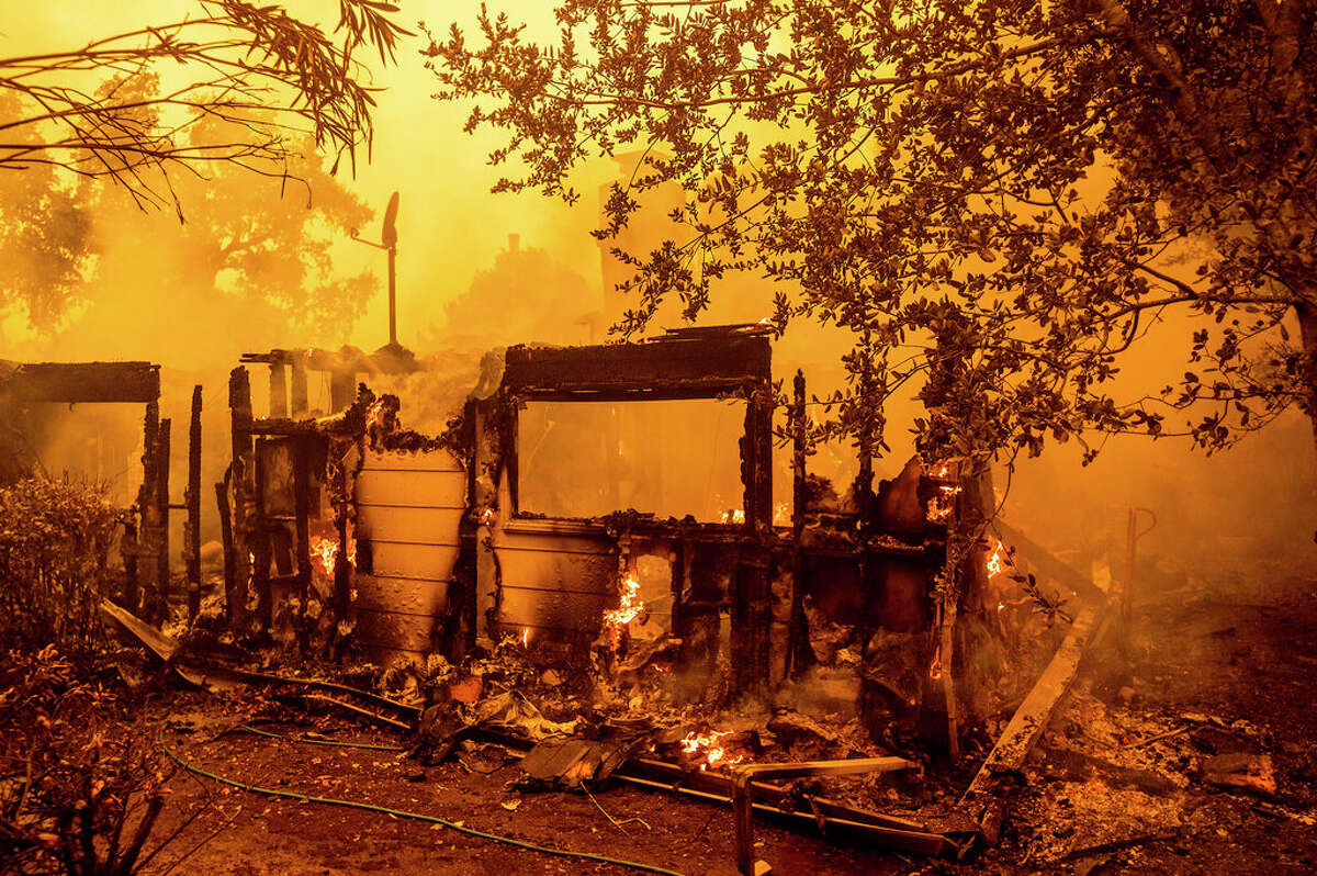 Flames consume an Oakmont neighborhood home as the Glass Fire burns in Santa Rosa, Calif., Monday, Sept. 28, 2020.