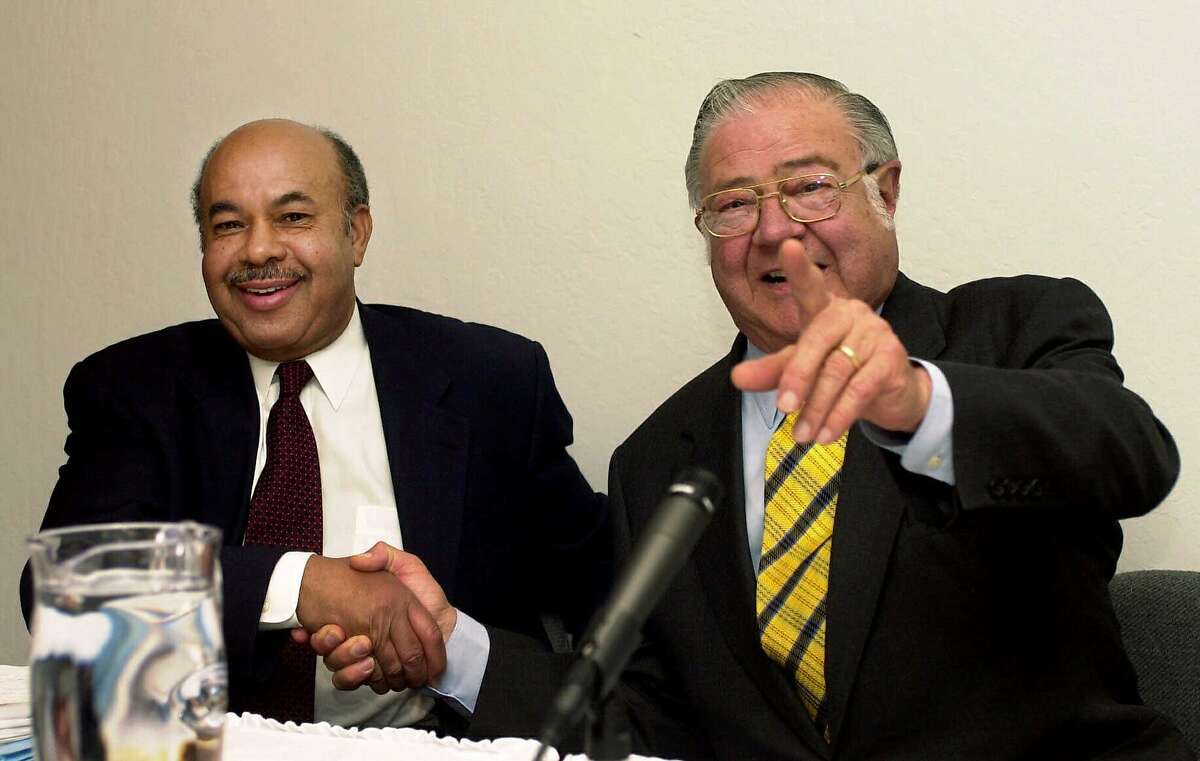 University of California regents William Bagley, right, and Ward Connerly, left, shake hands before their debate on 'Race Preference: Pro and Con' at the Independent Policy Forum in Oakland, Calif., Tuesday, April 25, 2000. The debate was over government affirmative action policies. (AP Photo/Paul Sakuma)