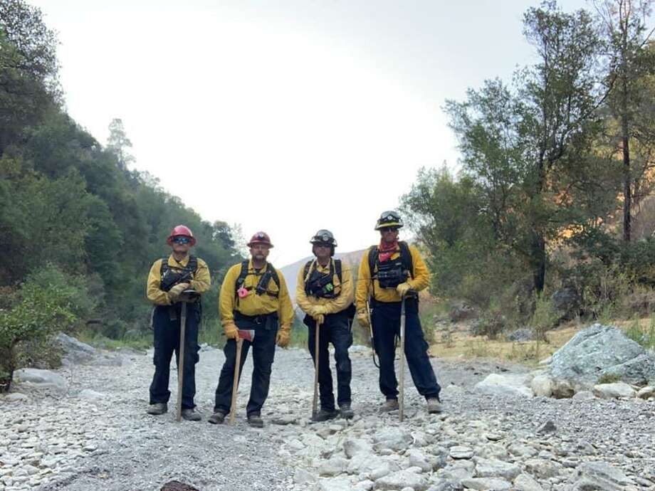 Fighting fires in the California wilderness are Schertz firefighters Carl Schultze (from left), Myron Boerger, Mack Melancon and Justin Schwersinske. Photo: Photo Courtesy Schertz Fire Department