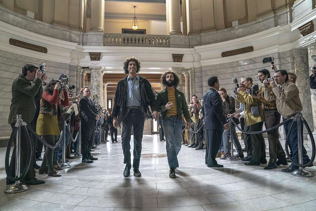 Sacha Baron Cohen, center left, and Jeremy Strong in "The Trial of the Chicago 7." Directed by Aaron Sorkin, it features Sasha Baron Cohen ("Borat"), Eddie Redmayne ("Fantastic Beasts"), Joseph Gordon-Levitt ("Inception") and Michael Keaton ("Spotlight"), among others. While it takes place almost 900 miles away, there are actually a lot of ties to Connecticut, in particular New Haven.