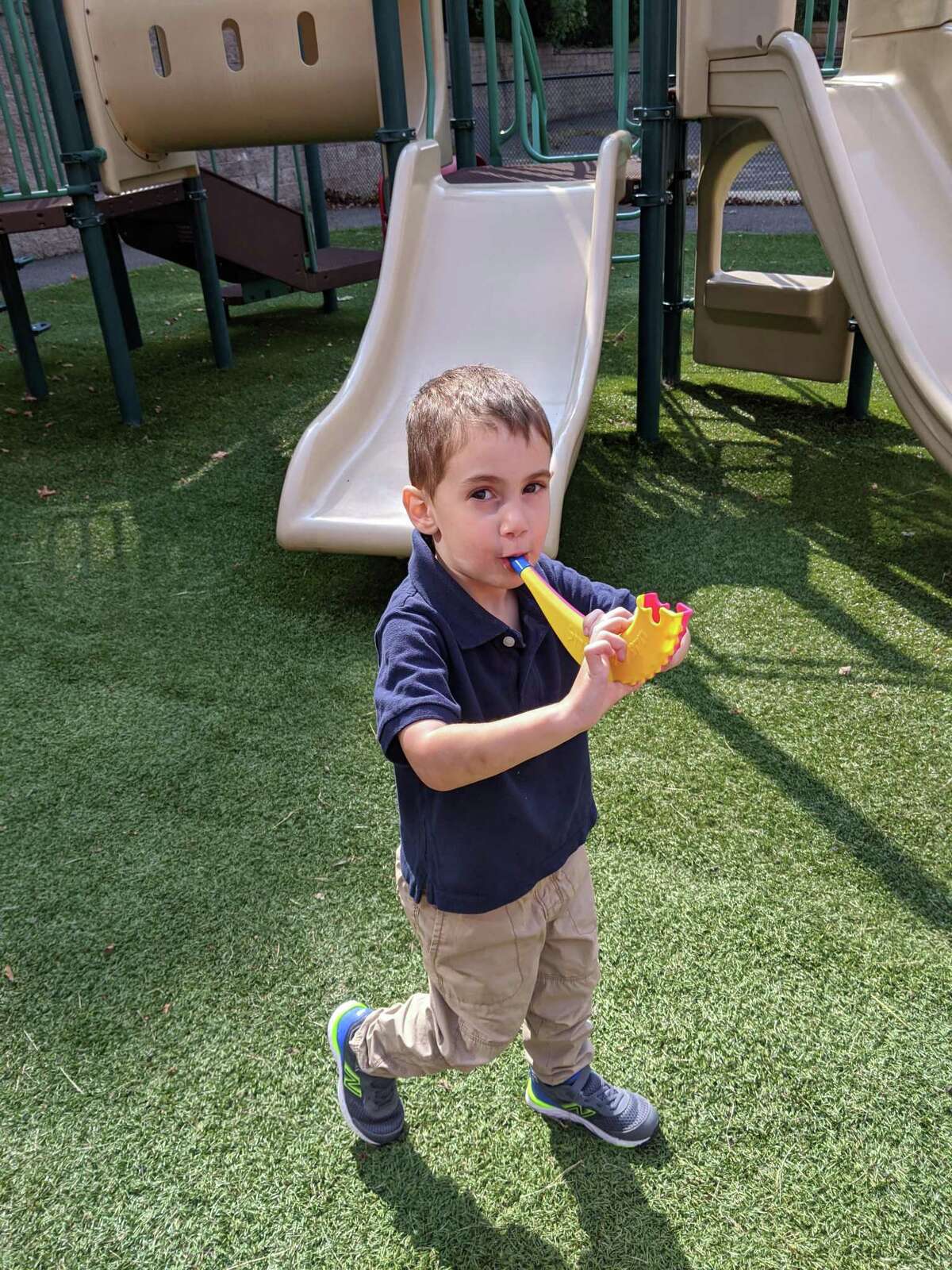 Children at B'nai Torah Nursery School blow shofars (pretend rams' horns) for Rosh Hashanah, the Jewish New Year, which began Friday, Sept. 18 at sundown. Apples and challah are dipped in honey for a sweet new year.