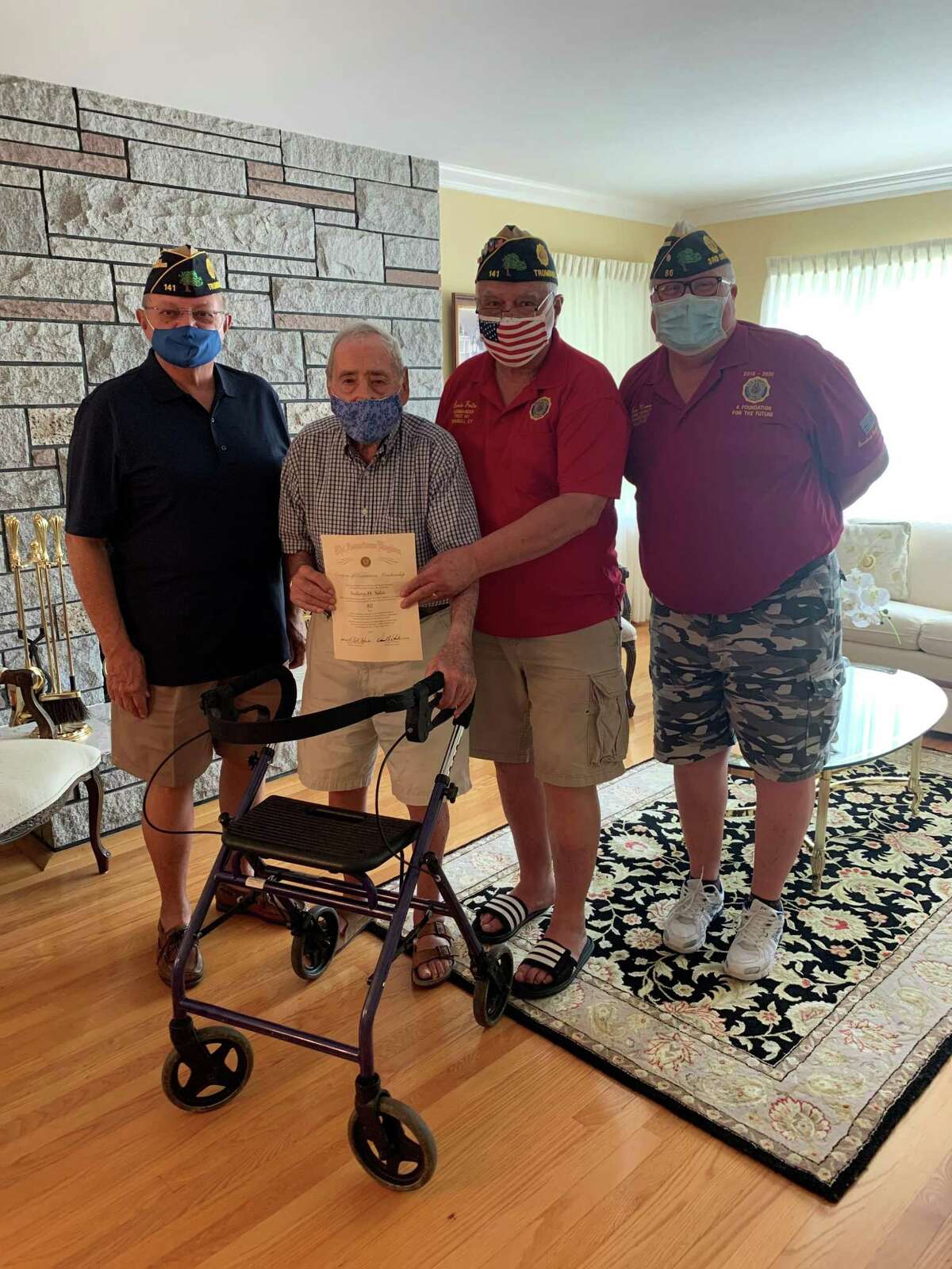 Anthony Salce was awarded a certificate for 80 years of continuous membership in the American Legion, which celebrated its 100th anniversary on June 10, 2019. At the same ceremony, Salce was given a seated walker. Anthony will turn 99 in January. He served in the United States Coast Guard during WWII and was at Normandy on D Day and is a member of American Legion Post 141 in Trumbull. Pictured are Senior-Vice Commander Joseph Montanaro, Commander Ernie Foito and District 3 Adjutant Tom Moore along with Salce.