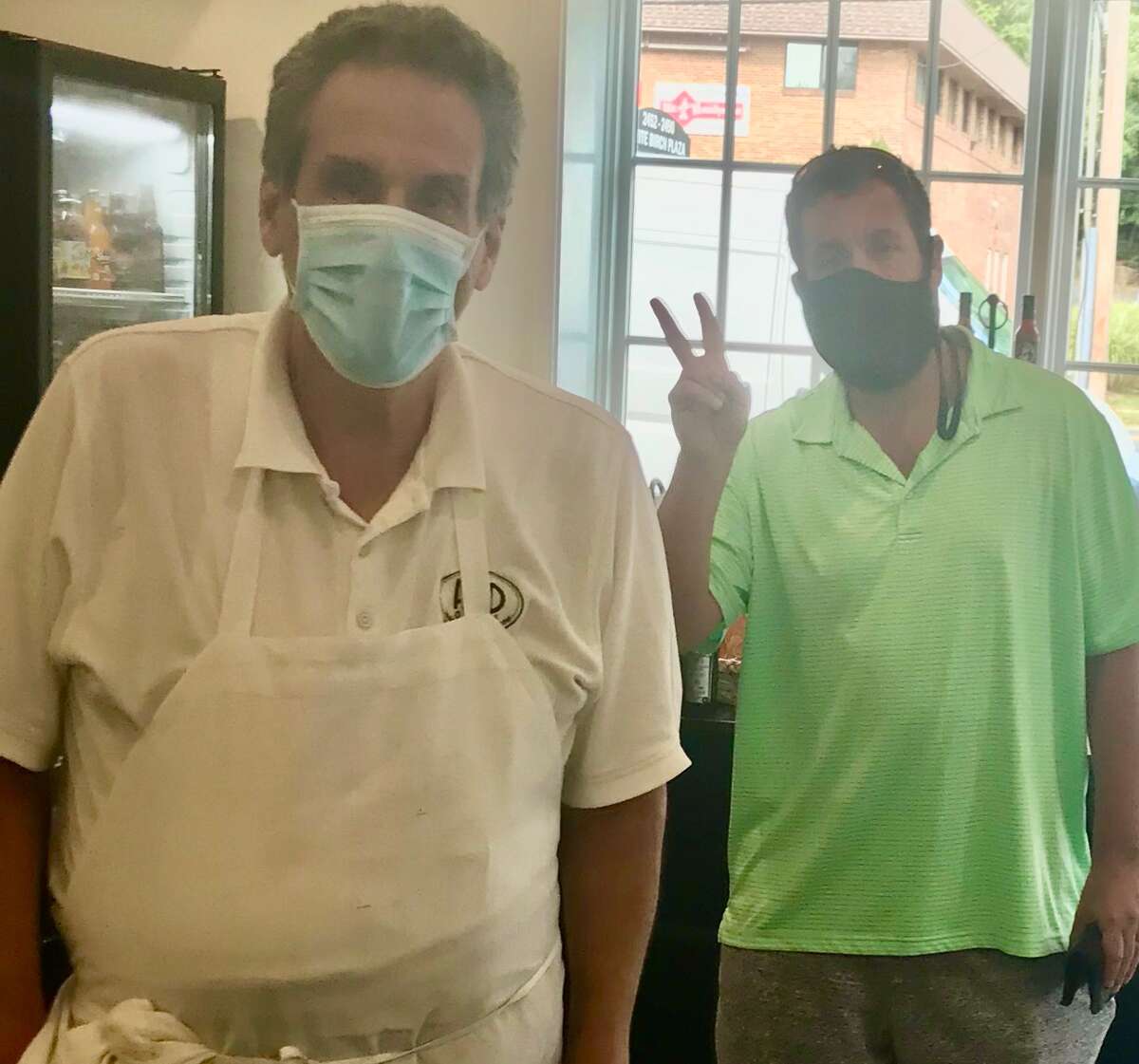 Adam Sandler and owner Fred Kaskowitz at Fred 06825 in Fairfield to pick up food on Sept. 28, 2020. "By happenstance, he walked into the store," said Kaskowitz. "We recognized him and had a nice conversation and took a couple photos...When he opened up his mouth to talk, that's when we knew it was him. [His voice was] a dead ringer." Kaskowitz said Sandler picked up his food, used the restroom and was on his way.  