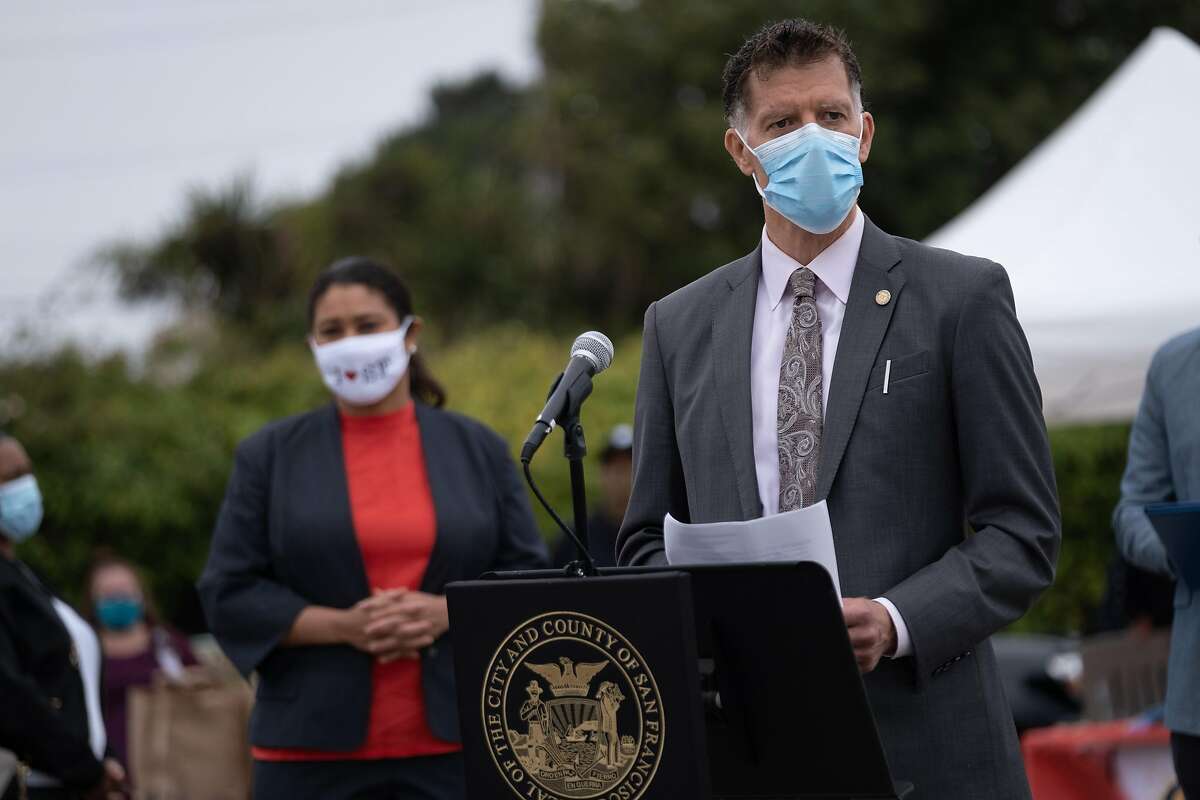 Health Director Dr. Grant Colfax speaks during a press conference at the Ocean View-Merced Heights-Ingleside virus testing center in San Francisco on Friday, September 18, 2020. Mayor London Breed announced that San Francisco restaurants may once again welcome diners inside as soon as the end of the month.