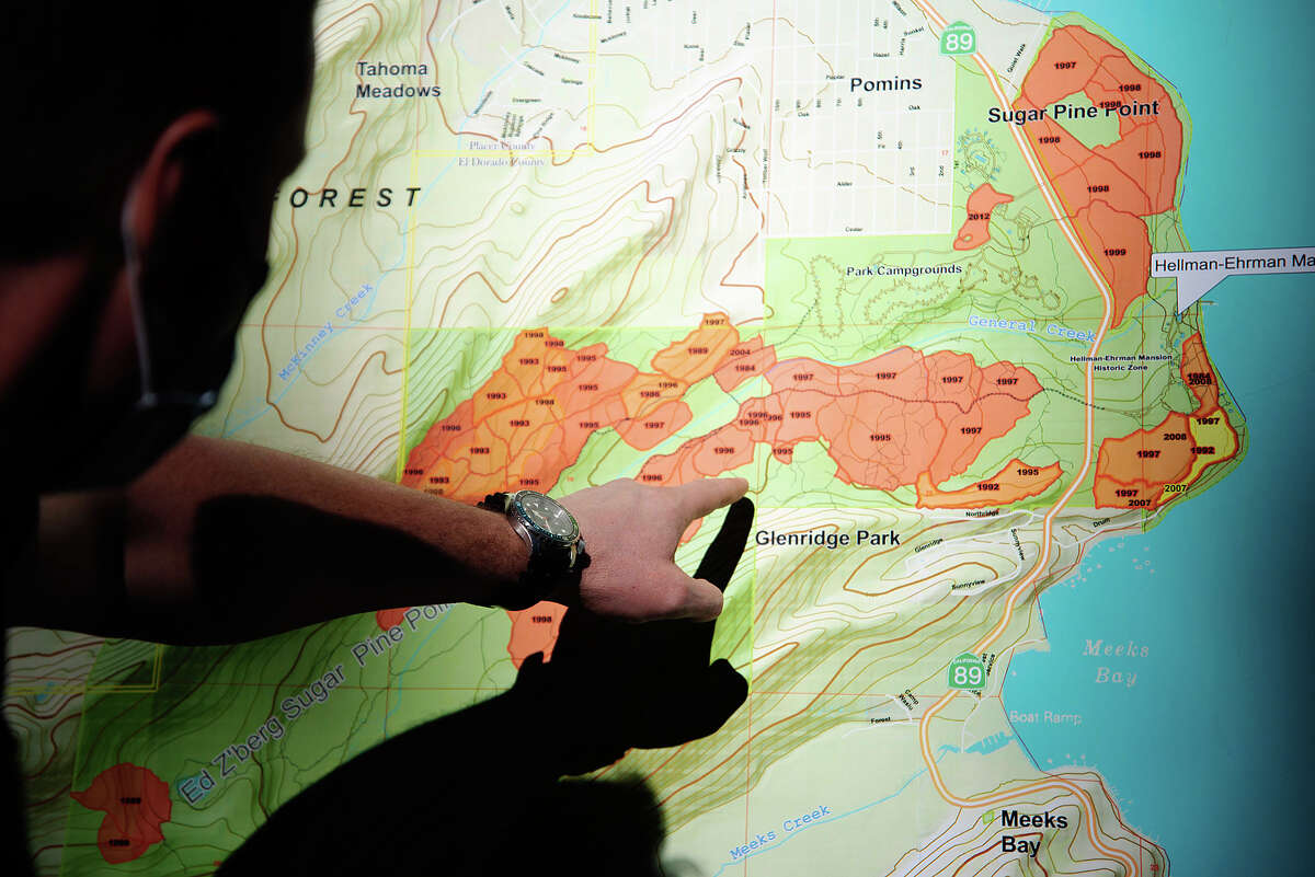 Rich Adams, a Forester II within the California State Parks system, points to plots of Ed Z'berg Sugar Pine Point State Park that have seen prescribed burns. The park's prescribed burn program started in 1984 in an effort to more closely mimic the natural fire cycles of Sierra Nevadan forests.