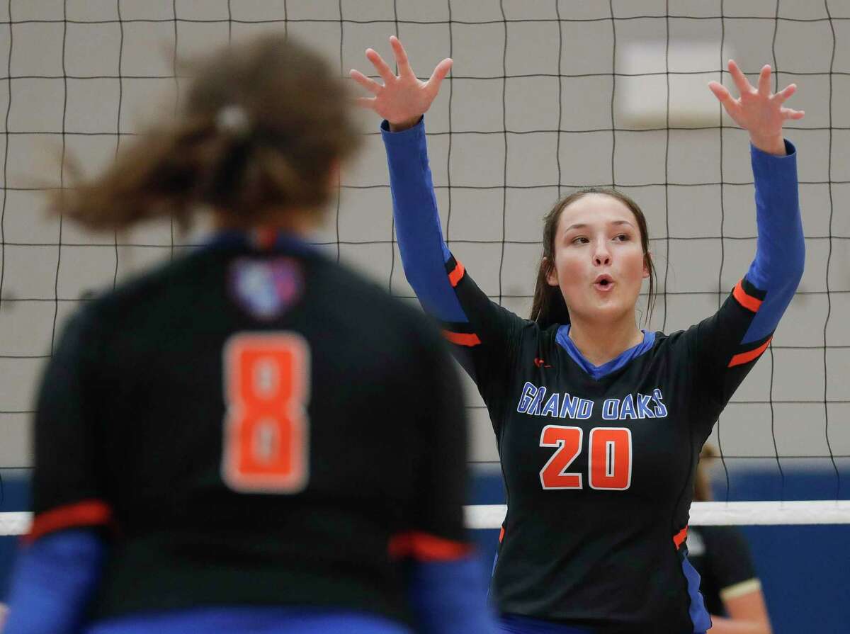Grand Oaks middle blocker Kailee Blanchard (20) reacts after blocking a shot by Summer Creek right side hitter Kaitlyn Honora during a non-district high school volleyball match at Grand Oaks High School, Tuesday, Sept. 29, 2020, in Spring.