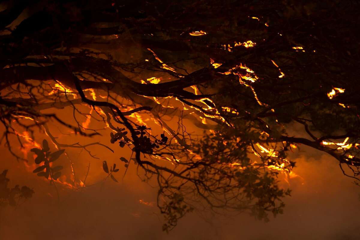 The Glass Fire burns above Rattlesnake Acres off of Highway 29 near Greenwood Avenue, Tuesday, Sept. 29, 2020, in Calistoga, Calif.