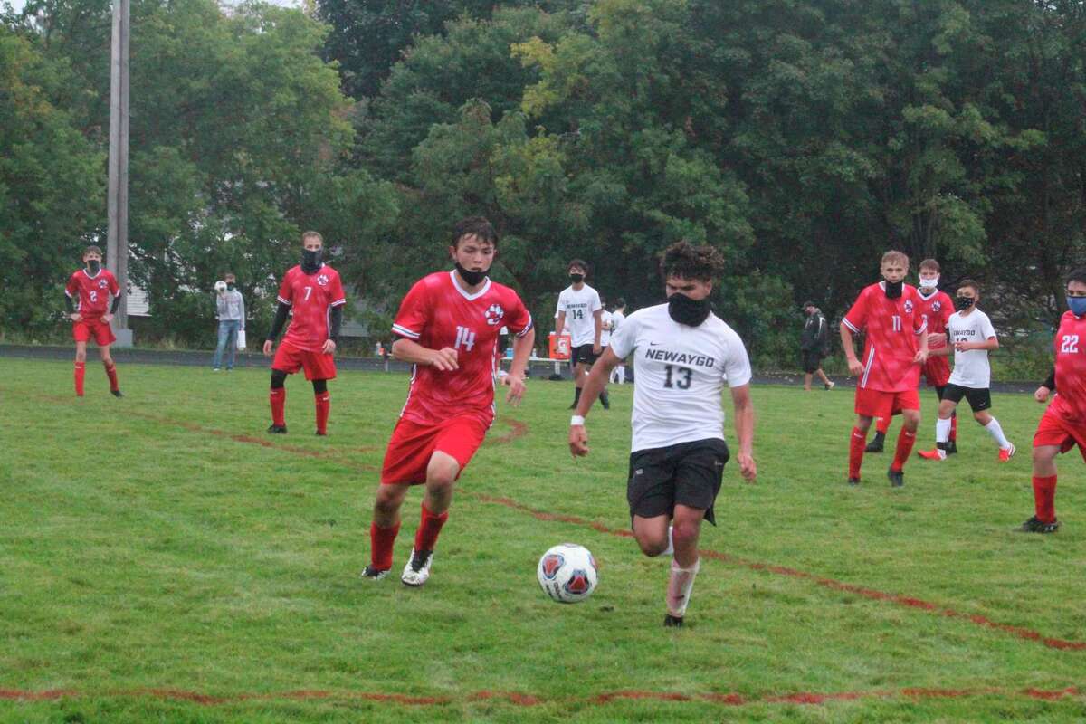 Porter Selfridge (left) has been a key player for Reed City's soccer team so far this season. (Herald-Review photo/John Raffel)