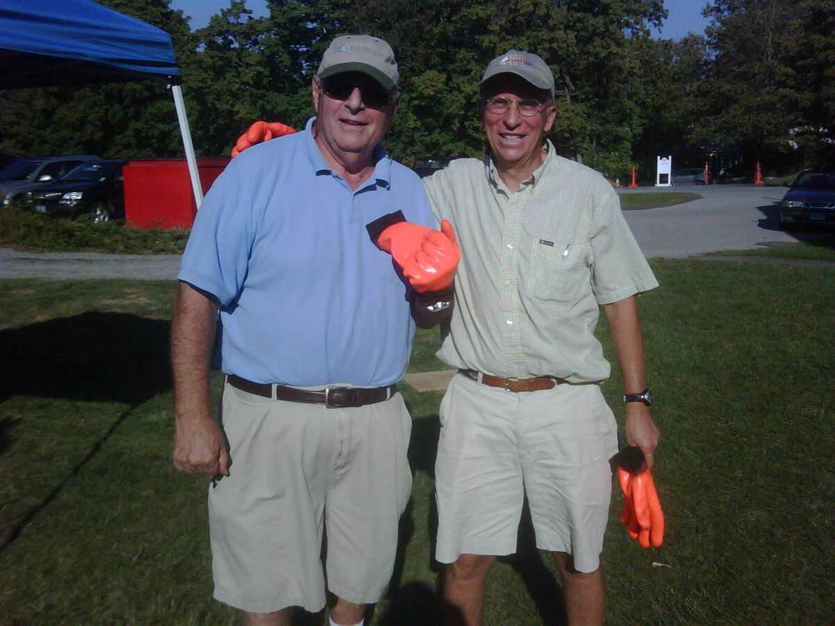 Joe Rucci and John Kerchoff, pictured in 2010 wearing lobster gloves, have been cooking at the New Canaan Rotary Lobsterfest almost since its inception 35 years ago.