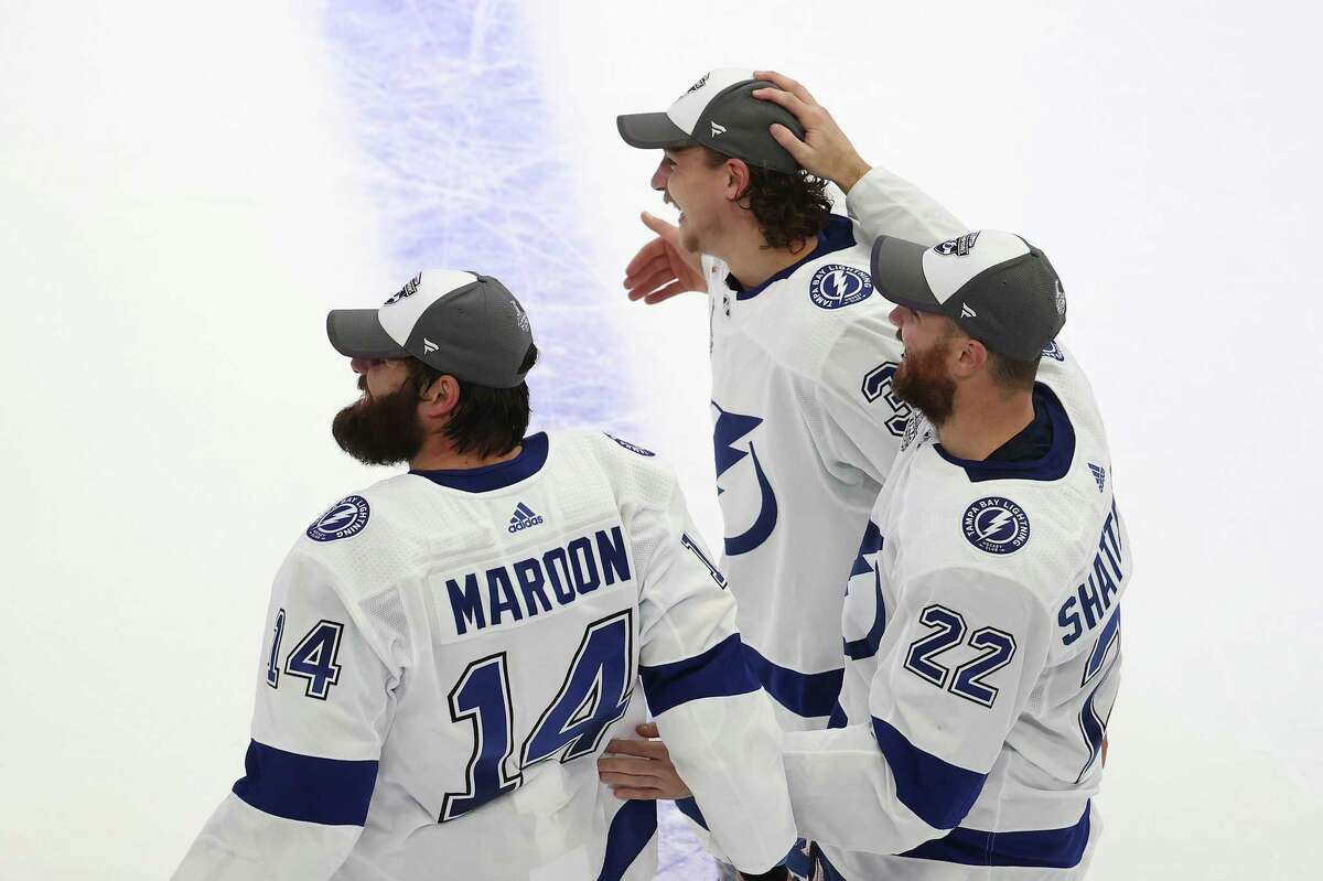 Pat Maroon #14, Kevin Shattenkirk #22 amd Yanni Gourde #37 pf the Tampa Bay Lightning celebrate following the series-winning victory over the Dallas Stars in Game Six of the 2020 NHL Stanley Cup Final at Rogers Place on September 28, 2020 in Edmonton, Alberta, Canada.